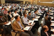 The crowd listens attentively to the keynote addresses. 
