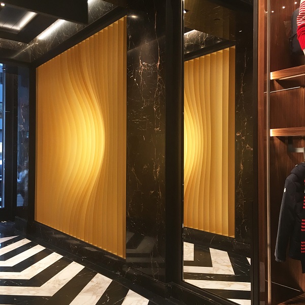Moncler Flagship Store in New York Illuminated in Golden Glowing Lights ...