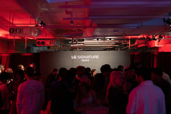 Partygoers enjoy the LG SIGNATURE lounge at The Gateway, an exclusive exhibition of NFT-based art and collectibles that was presented by nft now and Christie’s.
